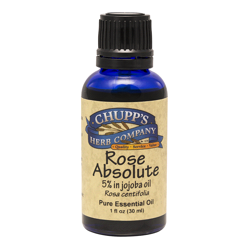 Blue bottle of Rose Absolute essential oil with 5% rose in jojoba oil for anti-inflammatory and hormonal balance benefits