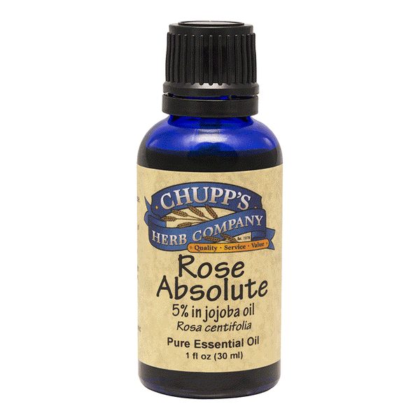Blue bottle of Rose Absolute essential oil with 5% rose in jojoba oil for anti-inflammatory and hormonal balance benefits