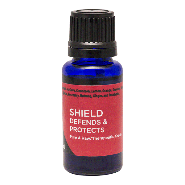 Blue bottle of Shield essential oil blend for immune support and skin relief