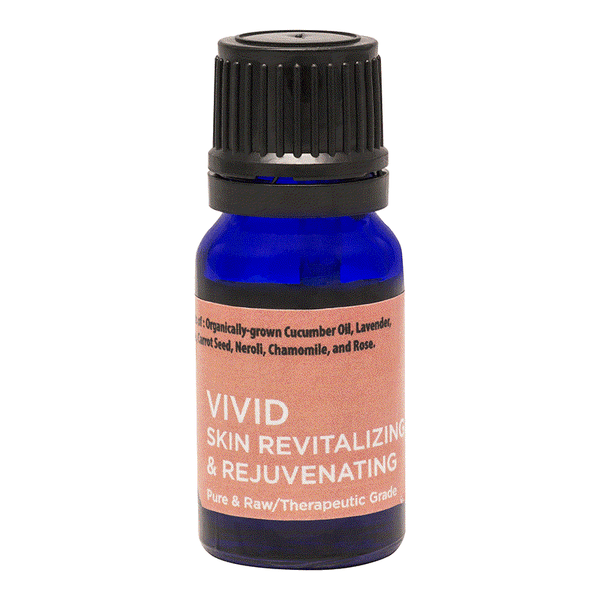 Blue bottle of Vivid essential oil blend for skin revitalizing and rejuvenating with cucumber and rose
